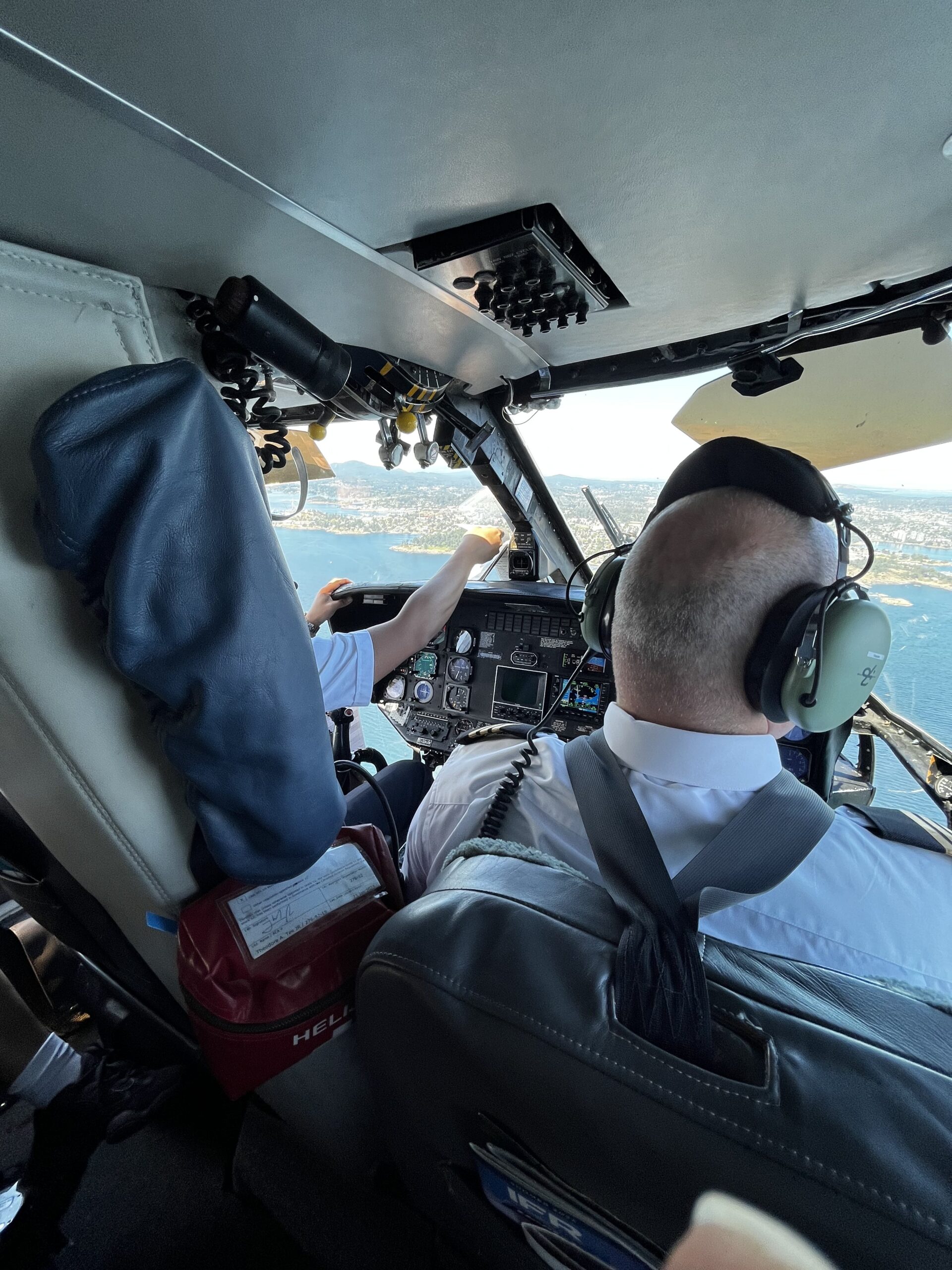 Helijet helicopter cockpit view approaching Victoria coastline
